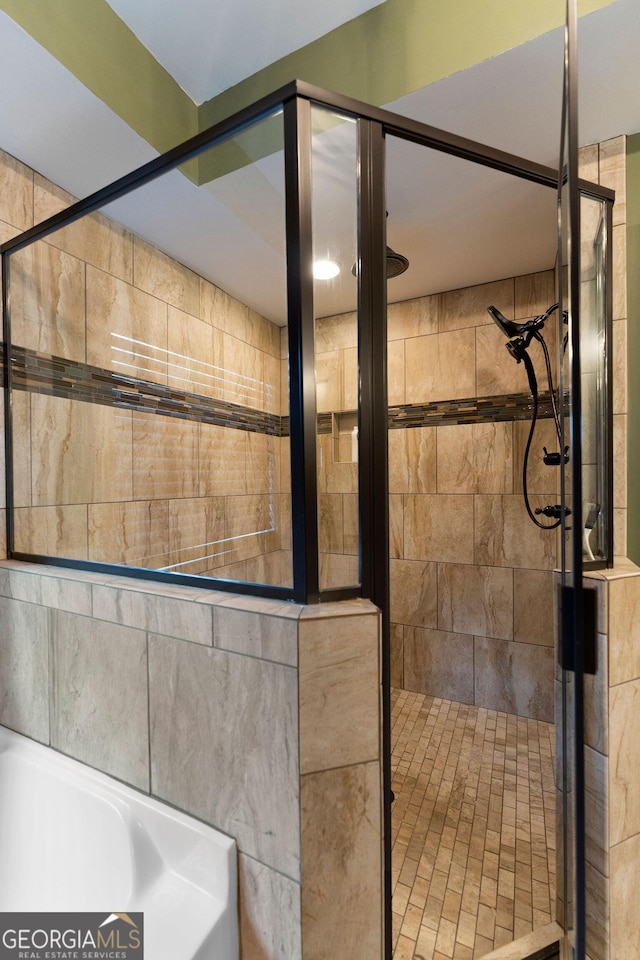 4 Bluff Ct SE, Cartersville, GA 30120 - bathroom featuring a stall shower and a tub to relax in