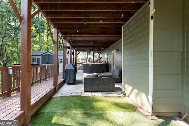 4 Bluff Ct SE, Cartersville, GA 30120 - wooden deck with a storage unit, outdoor lounge area, and area for grilling