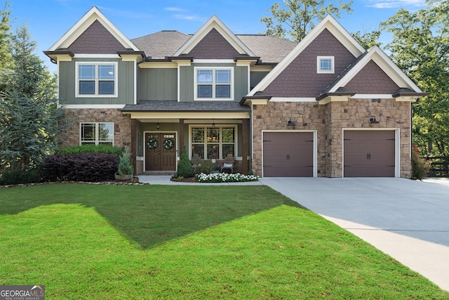 4 Bluff Ct SE, Cartersville, GA 30120 - craftsman-style home featuring board and batten siding, concrete driveway, stone siding, a front lawn, and an attached garage