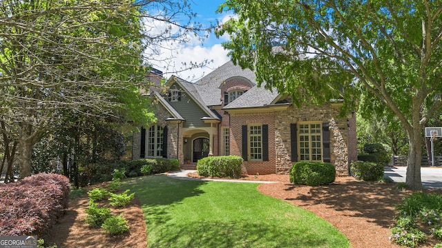 755 Cooper Sandy Cv, Alpharetta, GA 30004 - view of front facade with a front yard, stone siding, and brick siding
