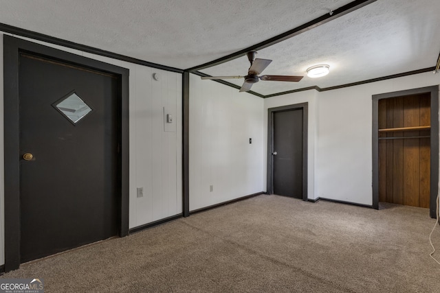 101 Leverett St, Warm Springs, GA 31830 - unfurnished bedroom with a textured ceiling, carpet floors, ornamental molding, and ceiling fan