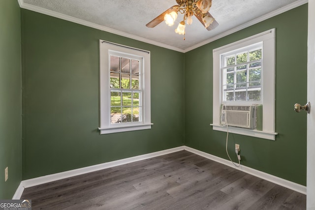 101 Leverett St, Warm Springs, GA 31830 - unfurnished room featuring dark wood-type flooring, cooling unit, a ceiling fan, ornamental molding, and a textured ceiling