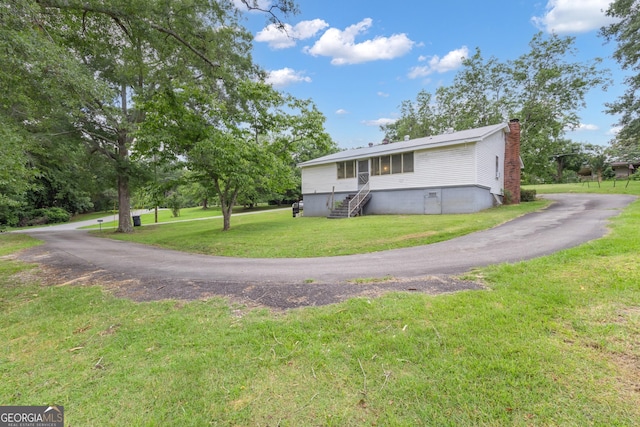 101 Leverett St, Warm Springs, GA 31830 - view of property exterior featuring a chimney and a lawn