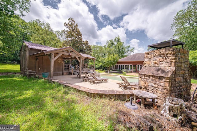 124 Old Salem Trl, Pine Mountain, GA 31822 - view of green lawn with a patio and an outdoor pool