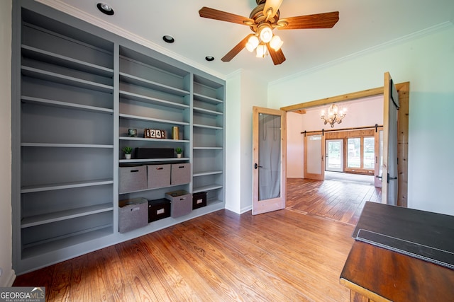 124 Old Salem Trl, Pine Mountain, GA 31822 - empty room featuring crown molding, wood finished floors, a chandelier, and ceiling fan
