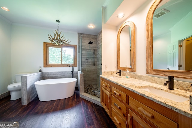 124 Old Salem Trl, Pine Mountain, GA 31822 - full bathroom featuring double vanity, a shower stall, a soaking tub, crown molding, and wood finished floors