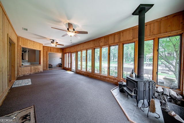 124 Old Salem Trl, Pine Mountain, GA 31822 - sunroom / solarium featuring a wood stove, wooden walls, and carpet floors