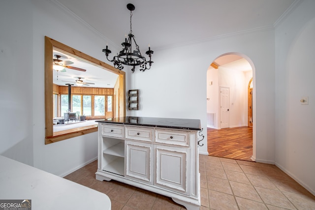 124 Old Salem Trl, Pine Mountain, GA 31822 - kitchen featuring light tile patterned flooring, crown molding, arched walkways, a ceiling fan, and open shelves