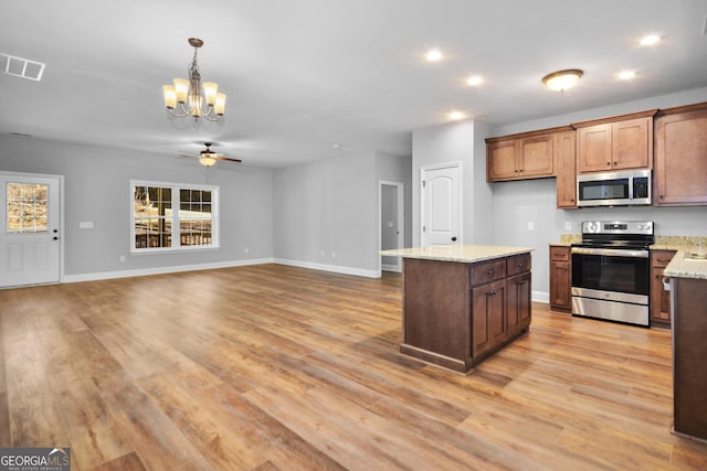 3177 Rodgers Creek Rd Unit 169, Ellijay, GA 30540 - kitchen with appliances with stainless steel finishes, a chandelier, a ceiling fan, recessed lighting, and light wood-type flooring