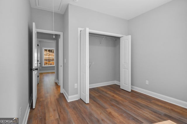 3177 Rodgers Creek Rd Unit 169, Ellijay, GA 30540 - unfurnished bedroom featuring attic access, dark wood-style flooring, and a closet