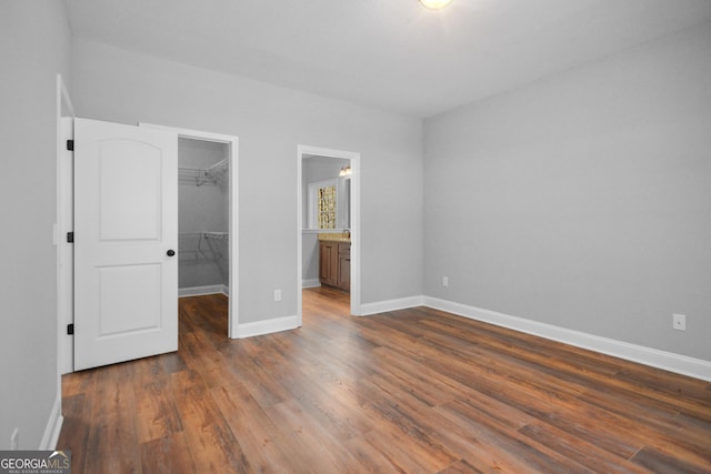 3177 Rodgers Creek Rd Unit 169, Ellijay, GA 30540 - unfurnished bedroom featuring a spacious closet, a closet, and dark wood finished floors