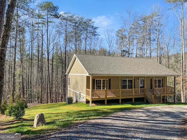 3177 Rodgers Creek Rd Unit 169, Ellijay, GA 30540 - view of front of house with a porch, a shingled roof, and a front lawn