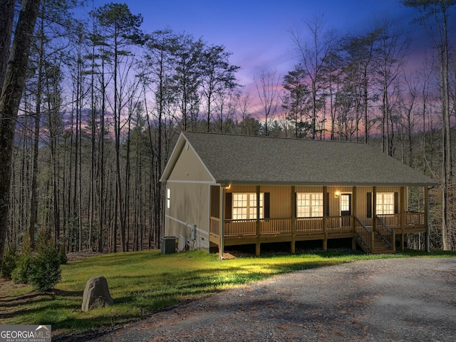3177 Rodgers Creek Rd Unit 169, Ellijay, GA 30540 - rustic home featuring a porch, roof with shingles, and a front yard