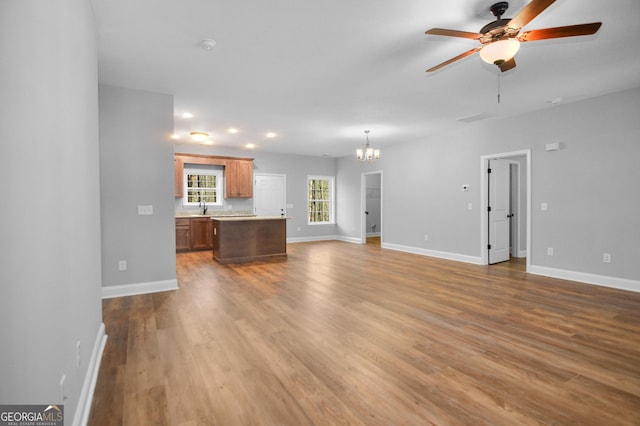3177 Rodgers Creek Rd Unit 169, Ellijay, GA 30540 - unfurnished living room featuring a chandelier, a ceiling fan, and wood finished floors