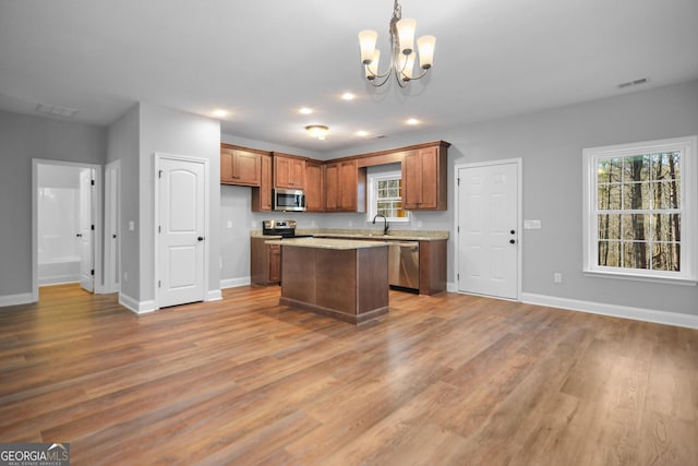 3177 Rodgers Creek Rd Unit 169, Ellijay, GA 30540 - kitchen featuring stainless steel appliances, a chandelier, light wood-type flooring, a center island, and pendant lighting