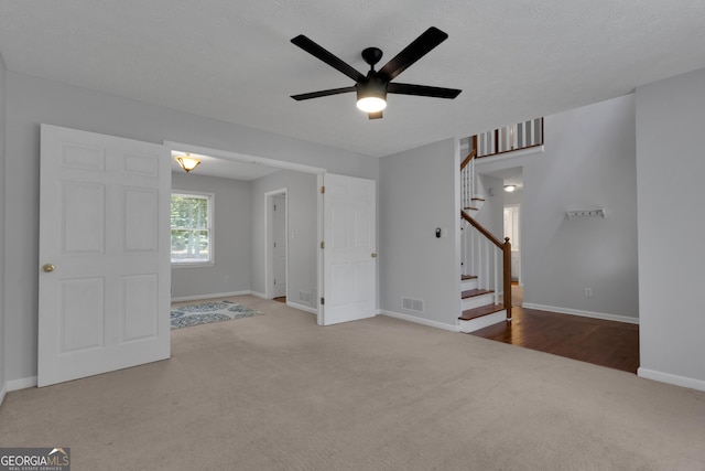 115 Rockhurst Chase, Tyrone, GA 30290 - carpeted empty room with a ceiling fan and stairs