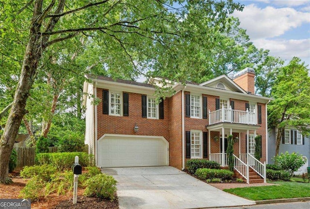 1117 Haven Glen Ln NE, Brookhaven, GA 30319 - georgian-style home featuring brick siding, concrete driveway, a garage, and a balcony