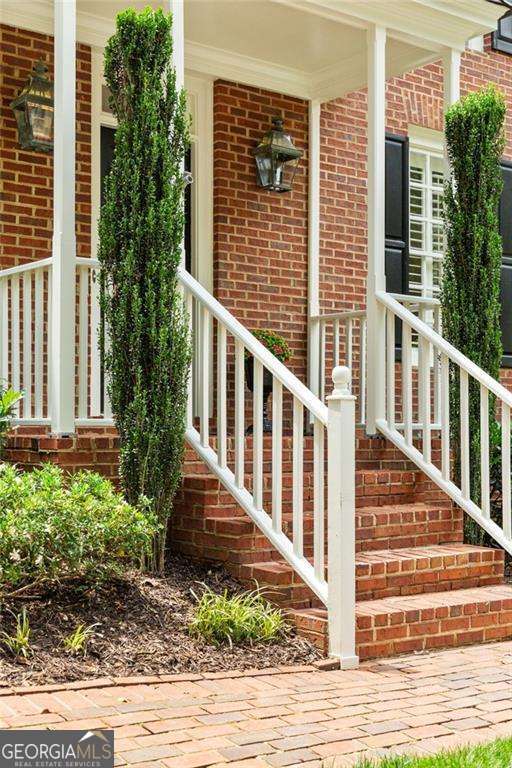 1117 Haven Glen Ln NE, Brookhaven, GA 30319 - entrance to property featuring brick siding and a porch