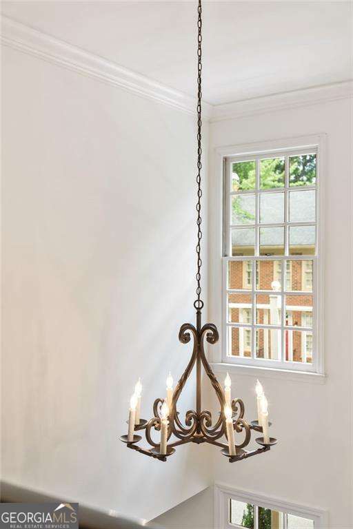 1117 Haven Glen Ln NE, Brookhaven, GA 30319 - detailed view of a chandelier and crown molding