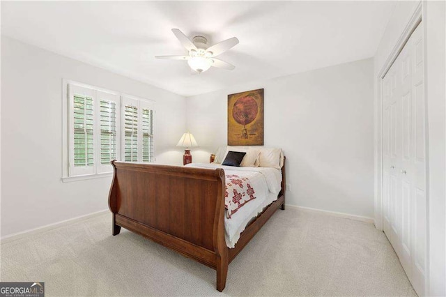 1117 Haven Glen Ln NE, Brookhaven, GA 30319 - bedroom with light colored carpet, a closet, and a ceiling fan