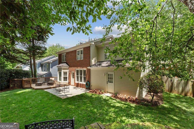 1117 Haven Glen Ln NE, Brookhaven, GA 30319 - back of house featuring a patio and brick siding