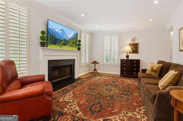 1117 Haven Glen Ln NE, Brookhaven, GA 30319 - living room featuring crown molding, a fireplace with flush hearth, recessed lighting, and wood finished floors
