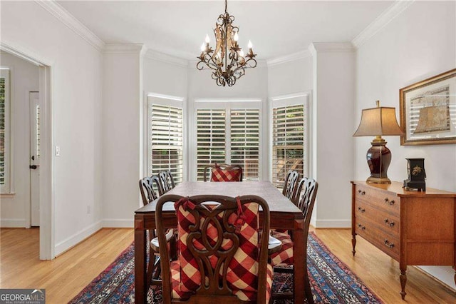 1117 Haven Glen Ln NE, Brookhaven, GA 30319 - dining area with light wood-style flooring, a chandelier, and ornamental molding