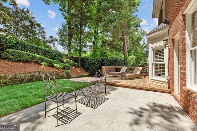 1117 Haven Glen Ln NE, Brookhaven, GA 30319 - fenced backyard with a deck and a patio area