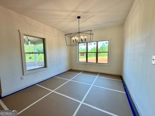3609 Youngs Mill Rd, Hogansville, GA 30230 - unfurnished dining area featuring a chandelier and baseboards