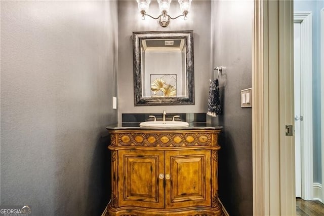 217 Fernwood Pl, Woodstock, GA 30188 - bathroom with vanity and a chandelier