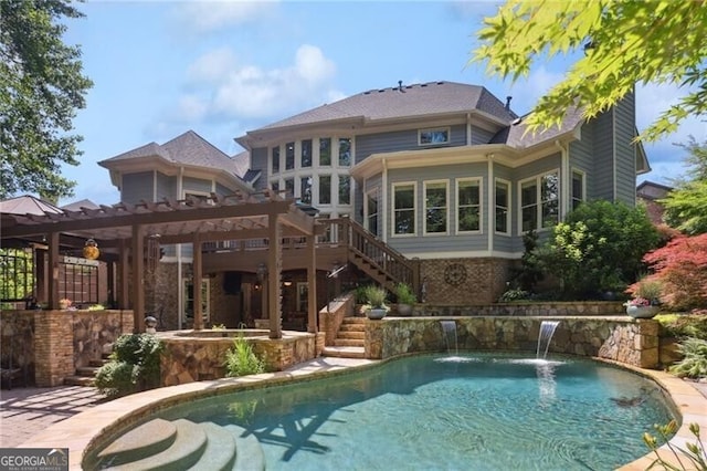 217 Fernwood Pl, Woodstock, GA 30188 - back of property with stairs, an outdoor pool, and a deck