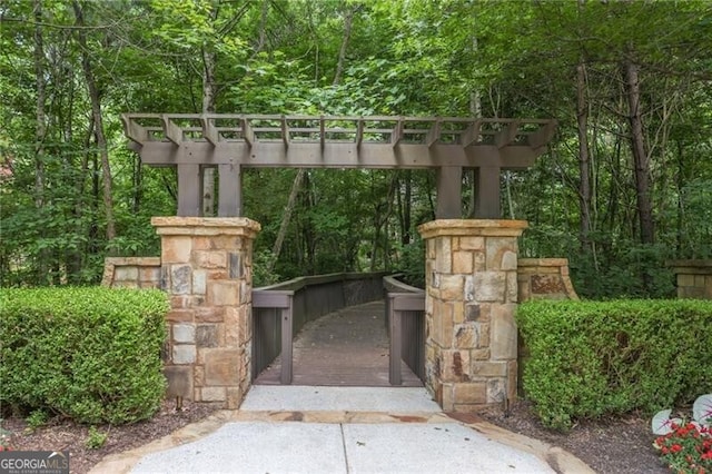 217 Fernwood Pl, Woodstock, GA 30188 - gate featuring a forest view