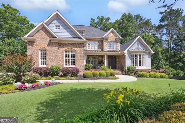 217 Fernwood Pl, Woodstock, GA 30188 - rear view of property featuring a lawn and brick siding
