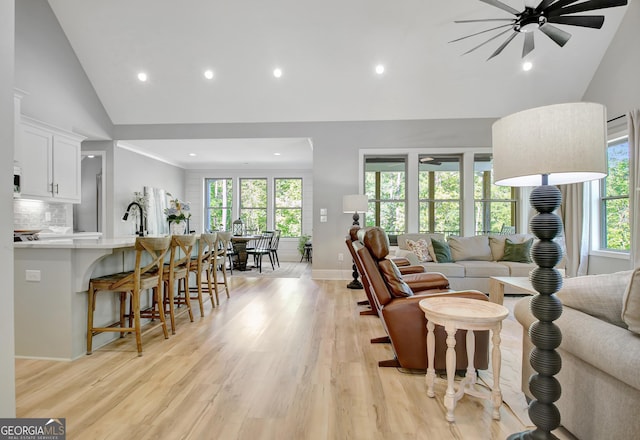 192 Greyfairs Ave, Senoia, GA 30276 - living room featuring high vaulted ceiling, ceiling fan, light wood-style floors, and recessed lighting