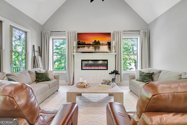 192 Greyfairs Ave, Senoia, GA 30276 - living room with high vaulted ceiling, plenty of natural light, a brick fireplace, and light marble finish flooring
