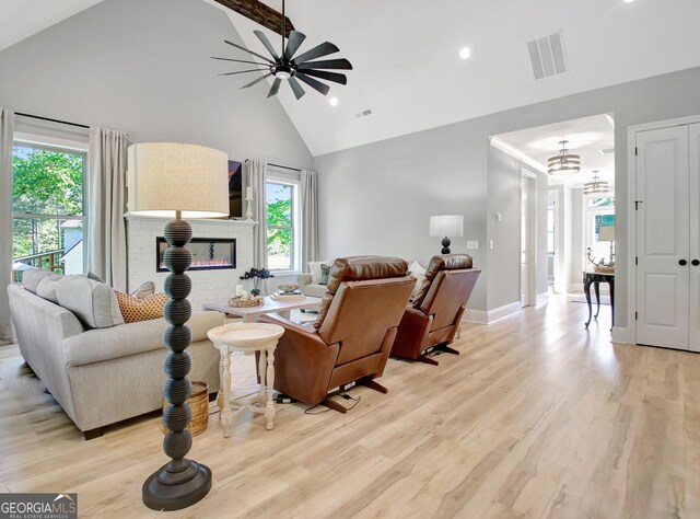 192 Greyfairs Ave, Senoia, GA 30276 - living room featuring high vaulted ceiling, a ceiling fan, light wood-style flooring, healthy amount of natural light, and recessed lighting