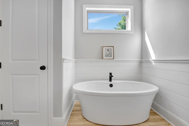 192 Greyfairs Ave, Senoia, GA 30276 - bathroom with a freestanding tub and wood finished floors