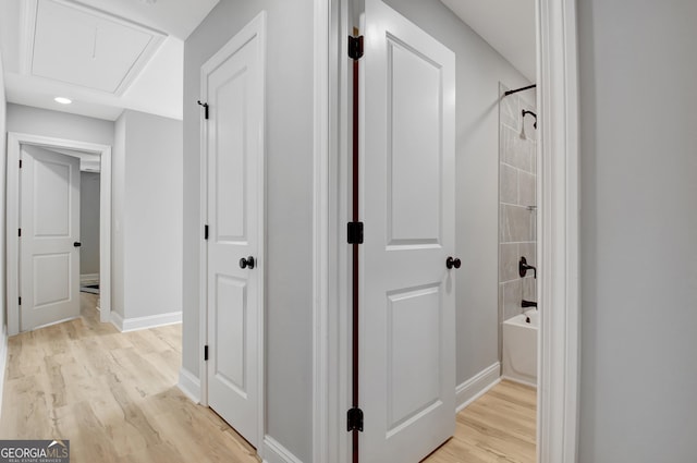 192 Greyfairs Ave, Senoia, GA 30276 - corridor featuring light wood-style flooring and attic access