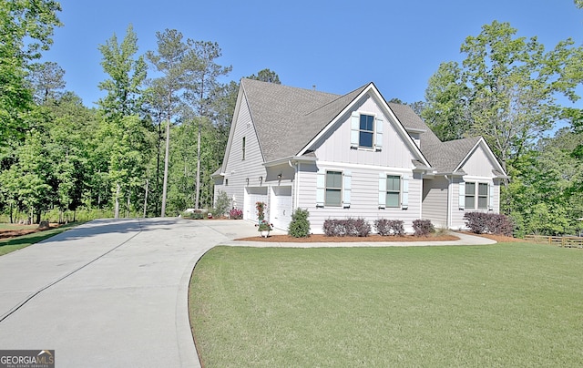 192 Greyfairs Ave, Senoia, GA 30276 - view of front of house with board and batten siding, driveway, a garage, and a front yard