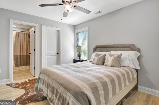 192 Greyfairs Ave, Senoia, GA 30276 - bedroom with wood finished floors, ensuite bath, and a ceiling fan