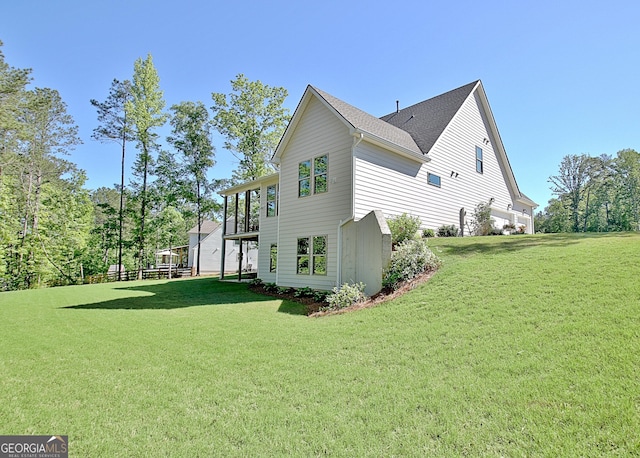 192 Greyfairs Ave, Senoia, GA 30276 - view of side of home featuring a lawn and roof with shingles