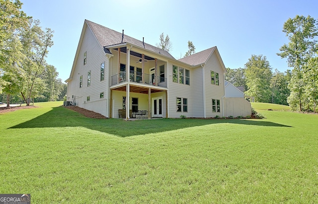 192 Greyfairs Ave, Senoia, GA 30276 - back of property with a ceiling fan, a lawn, a balcony, and roof with shingles