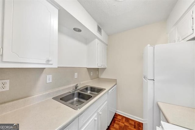 58 Monet Ct NW, Atlanta, GA 30327 - kitchen featuring white appliances, white cabinets, light countertops, and a textured ceiling