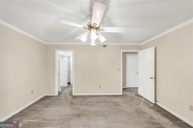 58 Monet Ct NW, Atlanta, GA 30327 - carpeted spare room with ornamental molding, a textured ceiling, and ceiling fan