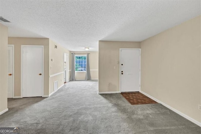58 Monet Ct NW, Atlanta, GA 30327 - foyer with carpet and a textured ceiling