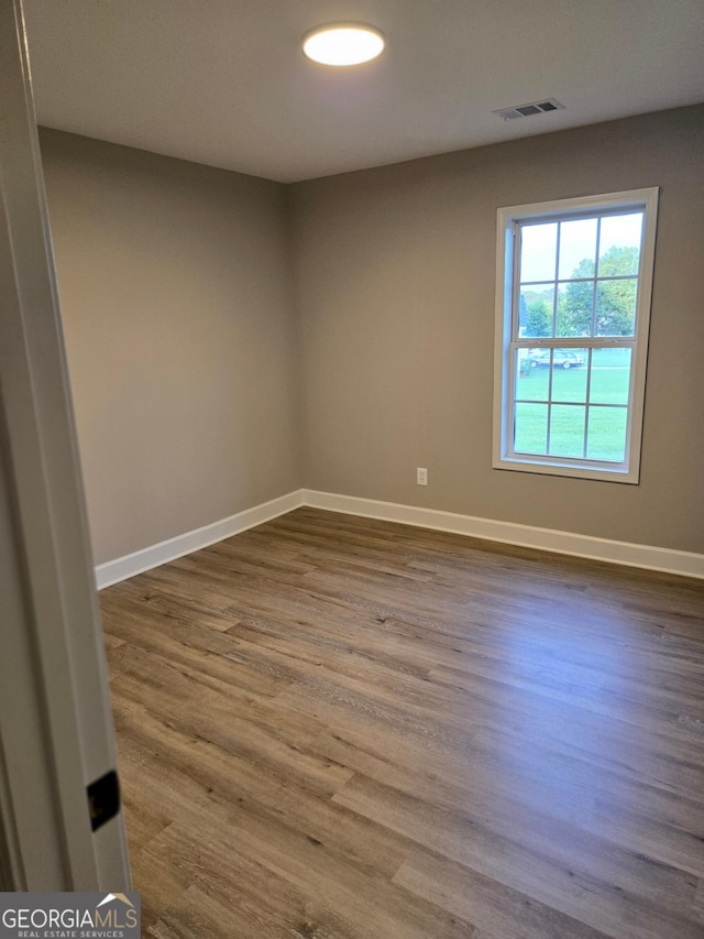 388 Kay Dr, Winder, GA 30680 - spare room featuring baseboards and dark wood-style flooring