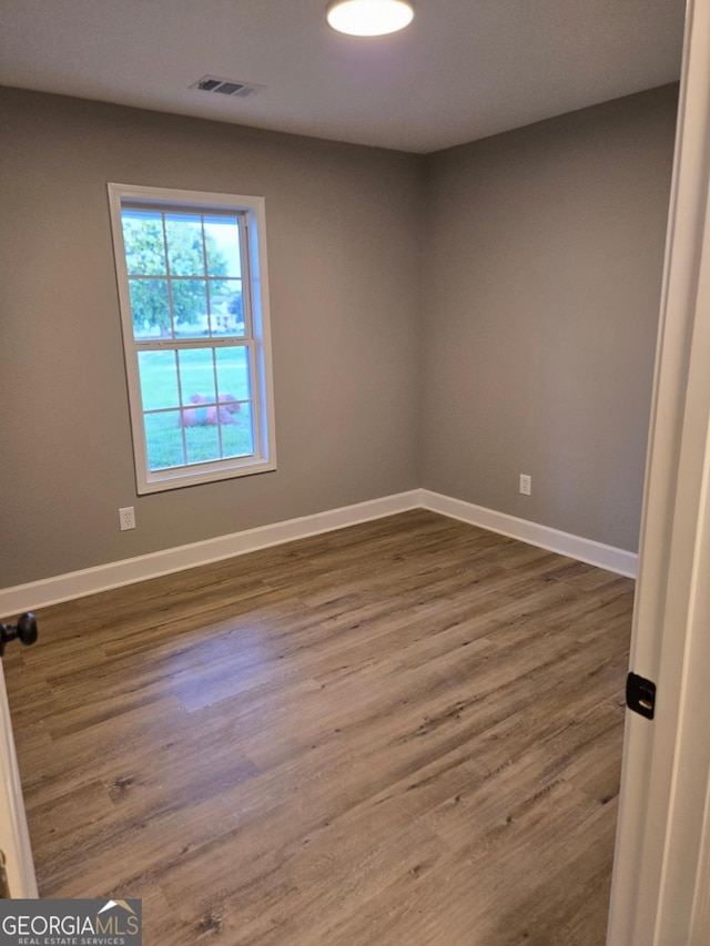 388 Kay Dr, Winder, GA 30680 - empty room with dark wood-style flooring and baseboards