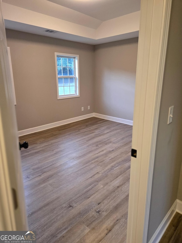 388 Kay Dr, Winder, GA 30680 - empty room with dark wood finished floors and baseboards