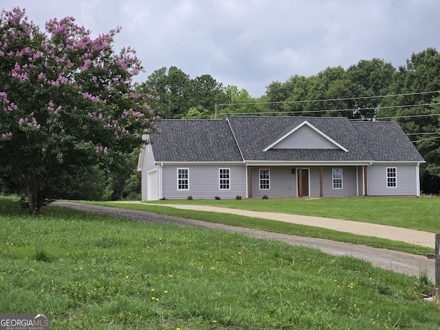 388 Kay Dr, Winder, GA 30680 - ranch-style home with a front lawn, an attached garage, and a shingled roof