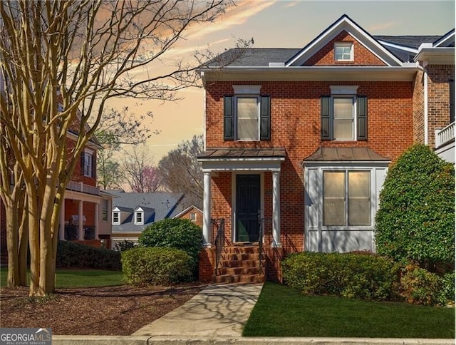 5210 Davenport Pl, Roswell, GA 30075 - view of front of house featuring brick siding, a standing seam roof, and a yard
